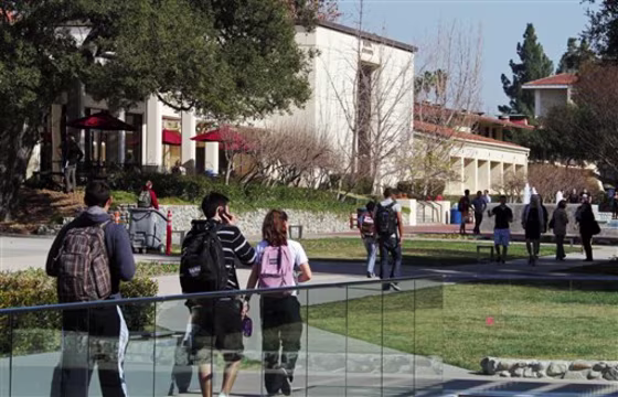 In this Thursday, Feb. 2, 2012 photo, students walk through the campus of Claremont McKenna College in Claremont, Calif.
